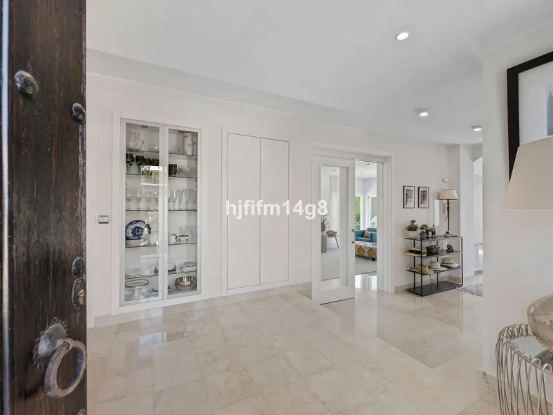 This charming villa is tucked away in a peaceful cul-de-sac within the exclusive gated community of Marbella Country Club, one of Nueva Andalucía's most desirable residential areas. Set on a flat and private south-facing plot, the property offers a perfec