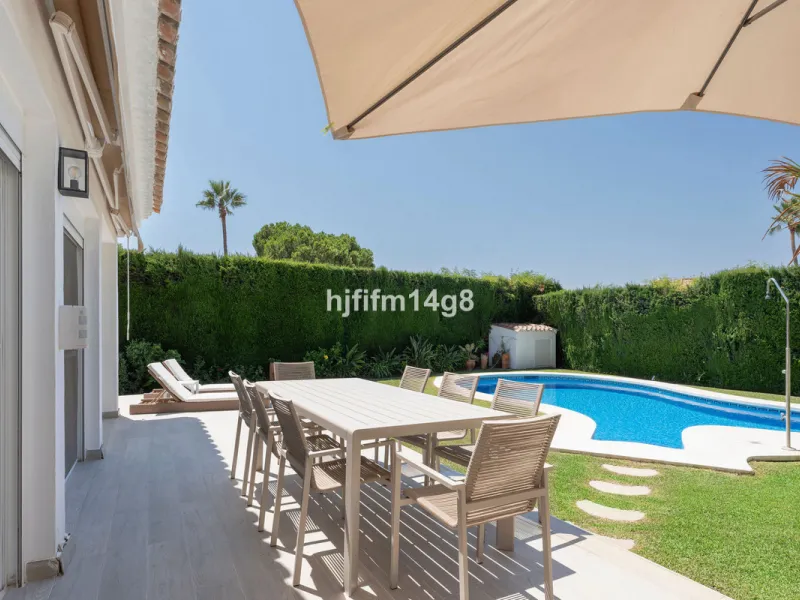 This charming villa is tucked away in a peaceful cul-de-sac within the exclusive gated community of Marbella Country Club, one of Nueva Andalucía's most desirable residential areas. Set on a flat and private south-facing plot, the property offers a perfec