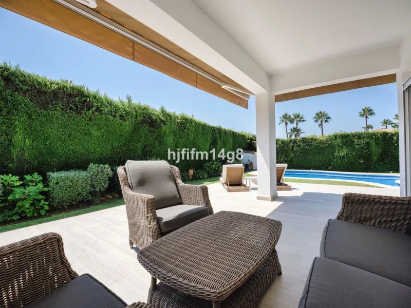 This charming villa is tucked away in a peaceful cul-de-sac within the exclusive gated community of Marbella Country Club, one of Nueva Andalucía's most desirable residential areas. Set on a flat and private south-facing plot, the property offers a perfec