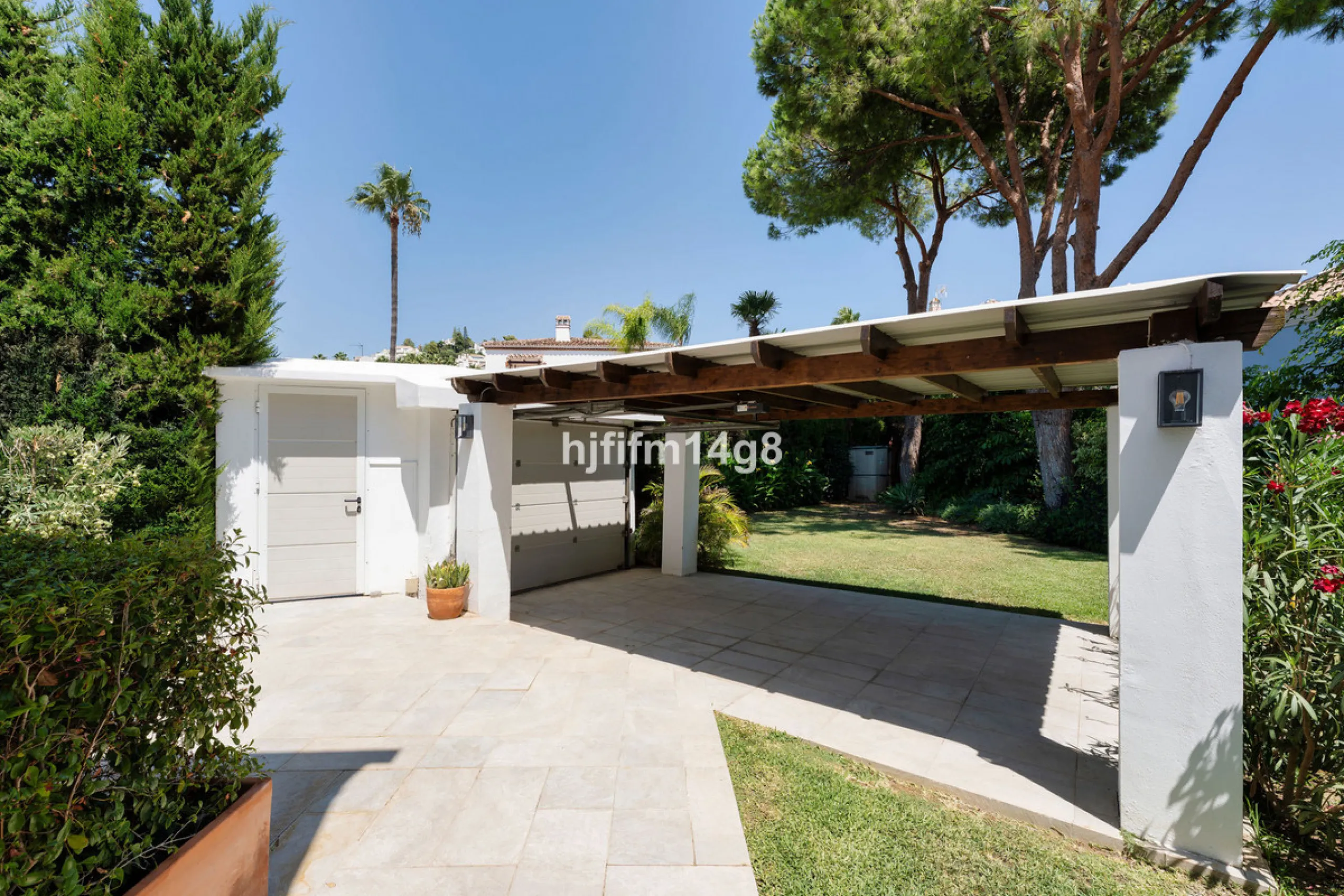 This charming villa is tucked away in a peaceful cul-de-sac within the exclusive gated community of Marbella Country Club, one of Nueva Andalucía's most desirable residential areas. Set on a flat and private south-facing plot, the property offers a perfec