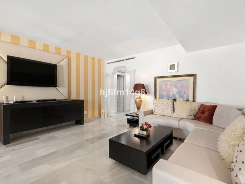This spacious apartment for sale in Benabola, Puerto Banús offers a rare opportunity to invest in one of Marbella's most prestigious marina-front locations. Situated in second line, the property enjoys front-line marina views while benefiting from the gre