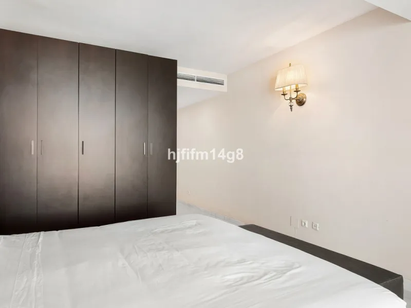 This spacious apartment for sale in Benabola, Puerto Banús offers a rare opportunity to invest in one of Marbella's most prestigious marina-front locations. Situated in second line, the property enjoys front-line marina views while benefiting from the gre