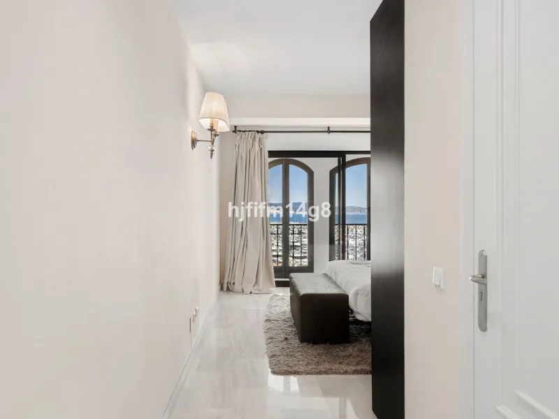 This spacious apartment for sale in Benabola, Puerto Banús offers a rare opportunity to invest in one of Marbella's most prestigious marina-front locations. Situated in second line, the property enjoys front-line marina views while benefiting from the gre