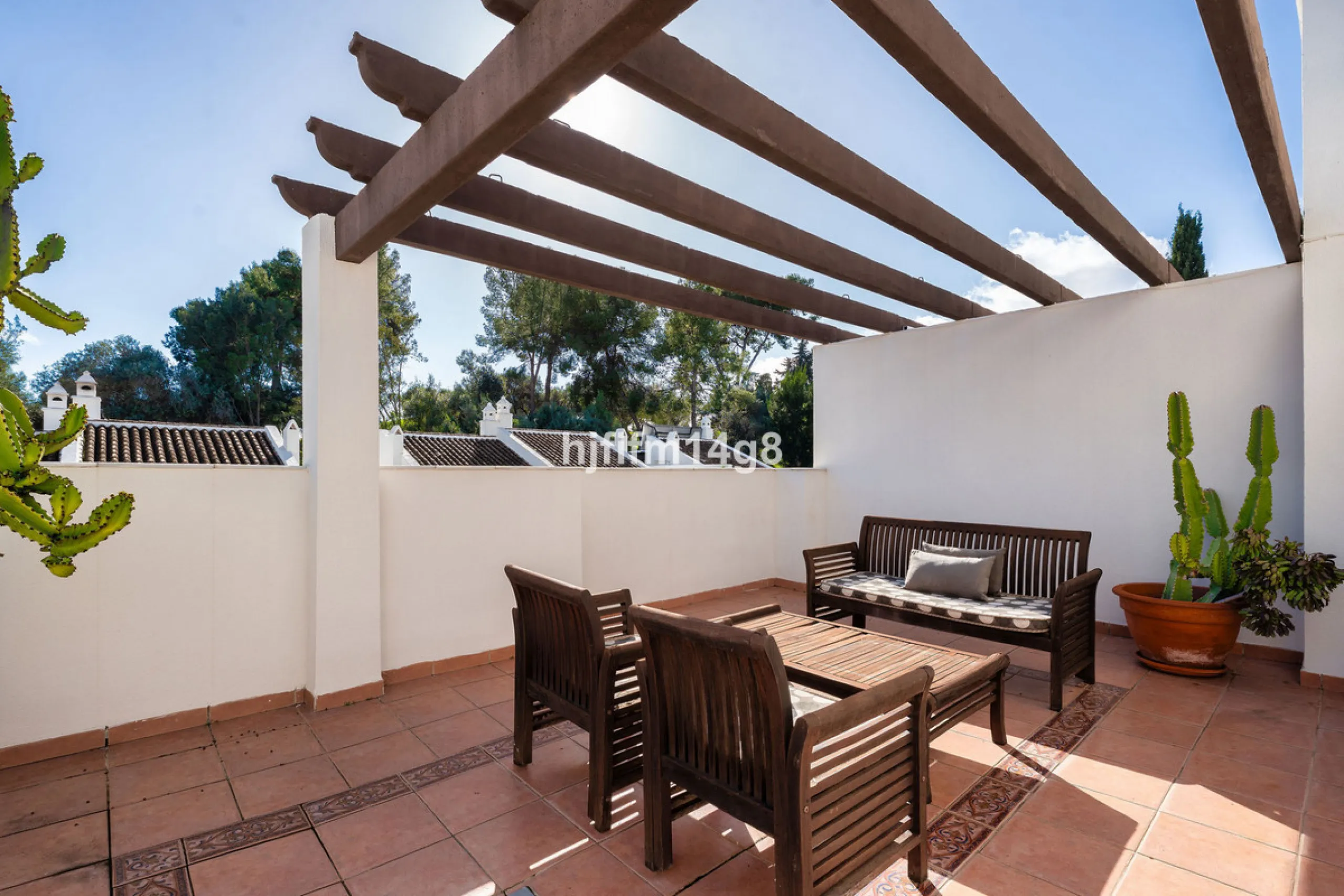 This stunning 3-bedroom townhouse is for sale in the highly sought-after El Alcornoque urbanisation in Nueva Andalucía, one of Marbella's most prestigious areas. Nestled front line to the renowned Aloha Golf Course, this exclusive development of just 22 u