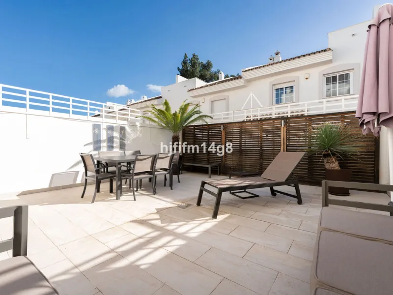 This stunning 3-bedroom townhouse is for sale in the highly sought-after El Alcornoque urbanisation in Nueva Andalucía, one of Marbella's most prestigious areas. Nestled front line to the renowned Aloha Golf Course, this exclusive development of just 22 u