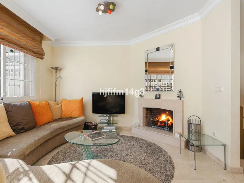 This stunning 3-bedroom townhouse is for sale in the highly sought-after El Alcornoque urbanisation in Nueva Andalucía, one of Marbella's most prestigious areas. Nestled front line to the renowned Aloha Golf Course, this exclusive development of just 22 u