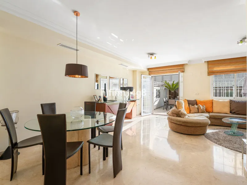 This stunning 3-bedroom townhouse is for sale in the highly sought-after El Alcornoque urbanisation in Nueva Andalucía, one of Marbella's most prestigious areas. Nestled front line to the renowned Aloha Golf Course, this exclusive development of just 22 u