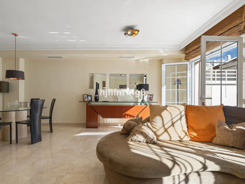This stunning 3-bedroom townhouse is for sale in the highly sought-after El Alcornoque urbanisation in Nueva Andalucía, one of Marbella's most prestigious areas. Nestled front line to the renowned Aloha Golf Course, this exclusive development of just 22 u