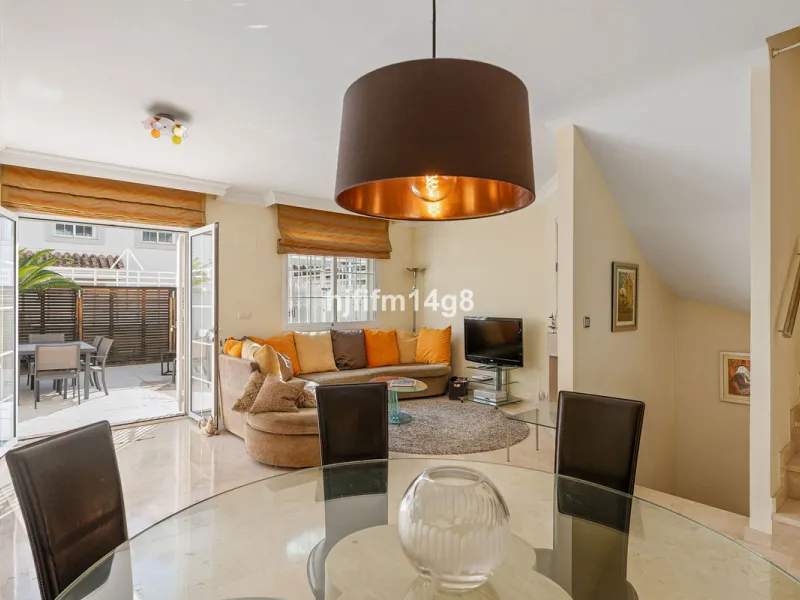 This stunning 3-bedroom townhouse is for sale in the highly sought-after El Alcornoque urbanisation in Nueva Andalucía, one of Marbella's most prestigious areas. Nestled front line to the renowned Aloha Golf Course, this exclusive development of just 22 u