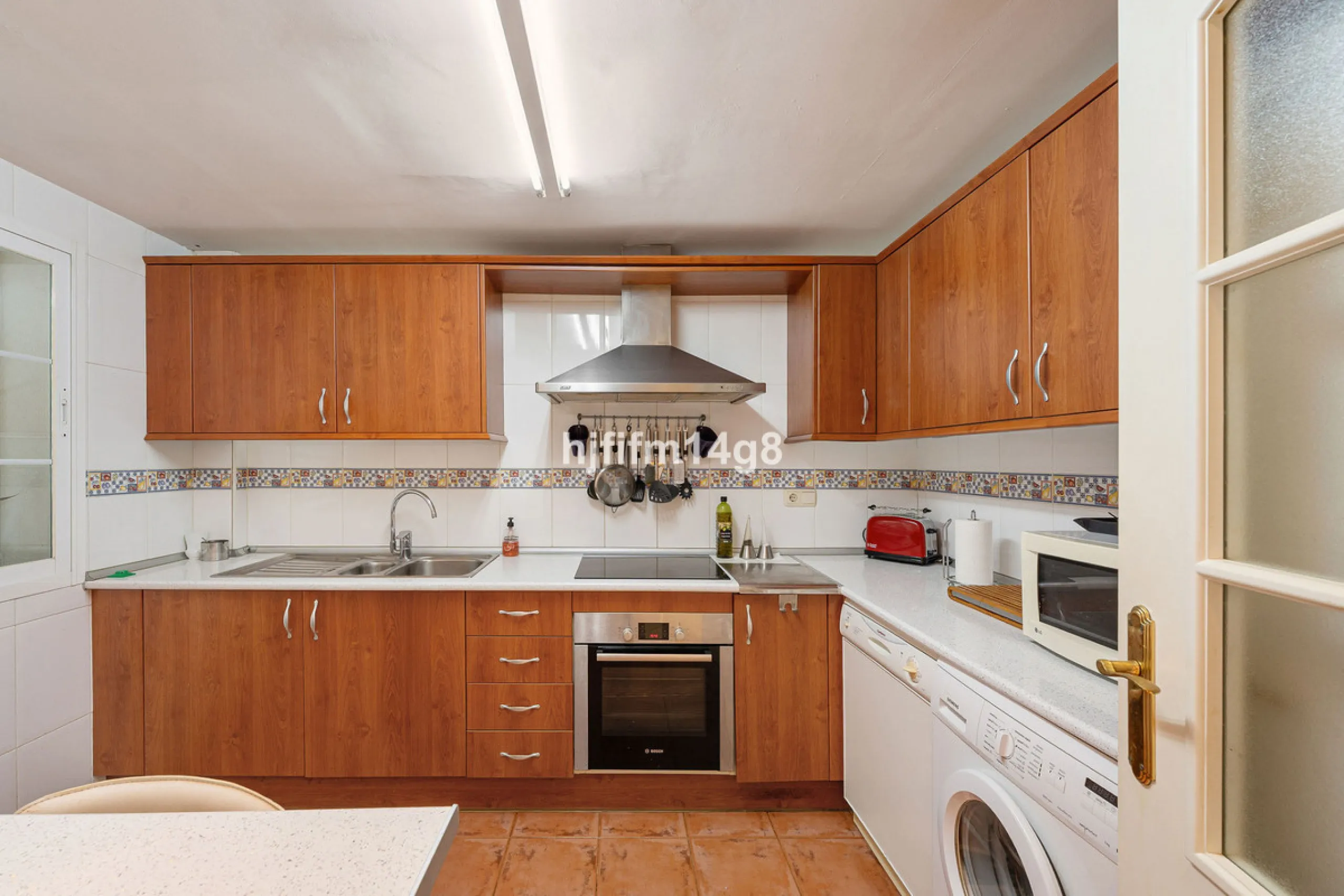 This stunning 3-bedroom townhouse is for sale in the highly sought-after El Alcornoque urbanisation in Nueva Andalucía, one of Marbella's most prestigious areas. Nestled front line to the renowned Aloha Golf Course, this exclusive development of just 22 u