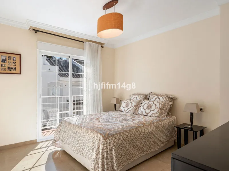 This stunning 3-bedroom townhouse is for sale in the highly sought-after El Alcornoque urbanisation in Nueva Andalucía, one of Marbella's most prestigious areas. Nestled front line to the renowned Aloha Golf Course, this exclusive development of just 22 u
