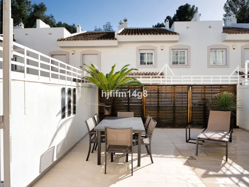 This stunning 3-bedroom townhouse is for sale in the highly sought-after El Alcornoque urbanisation in Nueva Andalucía, one of Marbella's most prestigious areas. Nestled front line to the renowned Aloha Golf Course, this exclusive development of just 22 u