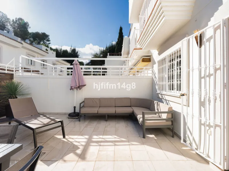 This stunning 3-bedroom townhouse is for sale in the highly sought-after El Alcornoque urbanisation in Nueva Andalucía, one of Marbella's most prestigious areas. Nestled front line to the renowned Aloha Golf Course, this exclusive development of just 22 u