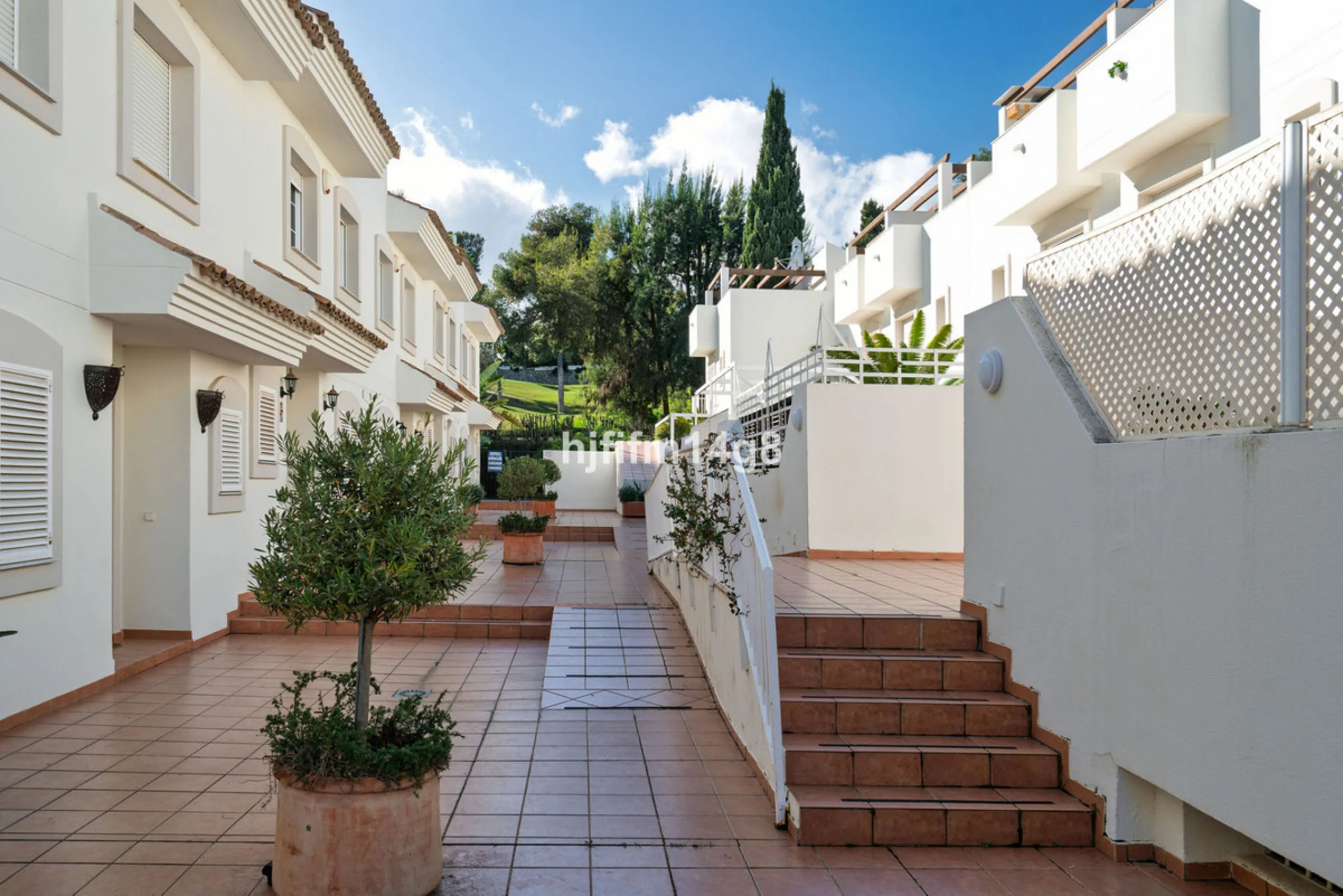 This stunning 3-bedroom townhouse is for sale in the highly sought-after El Alcornoque urbanisation in Nueva Andalucía, one of Marbella's most prestigious areas. Nestled front line to the renowned Aloha Golf Course, this exclusive development of just 22 u