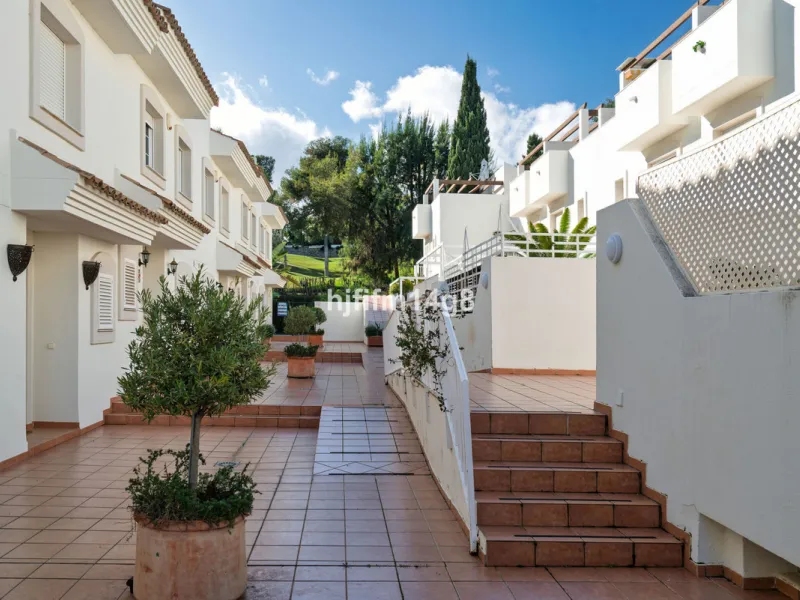 This stunning 3-bedroom townhouse is for sale in the highly sought-after El Alcornoque urbanisation in Nueva Andalucía, one of Marbella's most prestigious areas. Nestled front line to the renowned Aloha Golf Course, this exclusive development of just 22 u