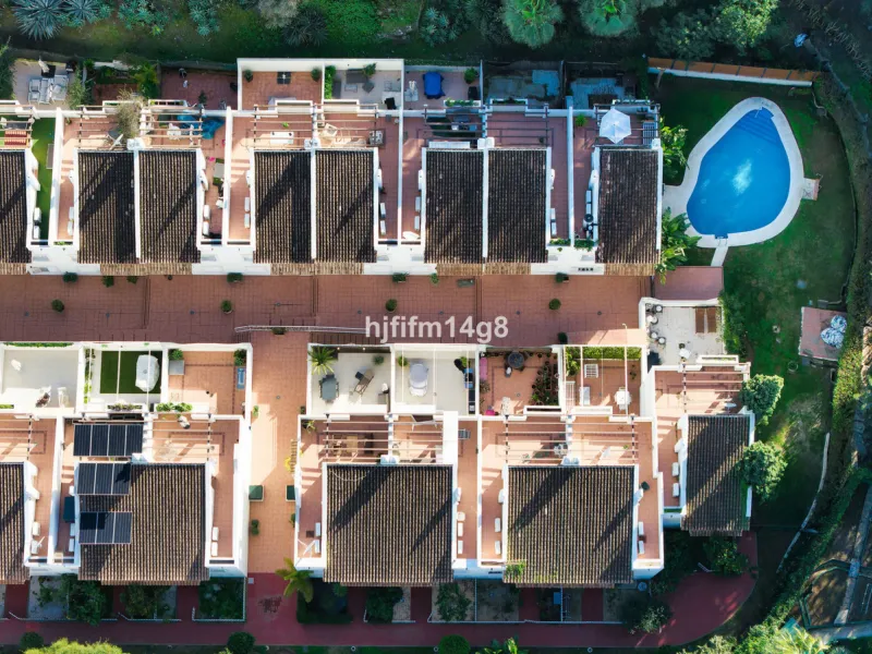 This stunning 3-bedroom townhouse is for sale in the highly sought-after El Alcornoque urbanisation in Nueva Andalucía, one of Marbella's most prestigious areas. Nestled front line to the renowned Aloha Golf Course, this exclusive development of just 22 u