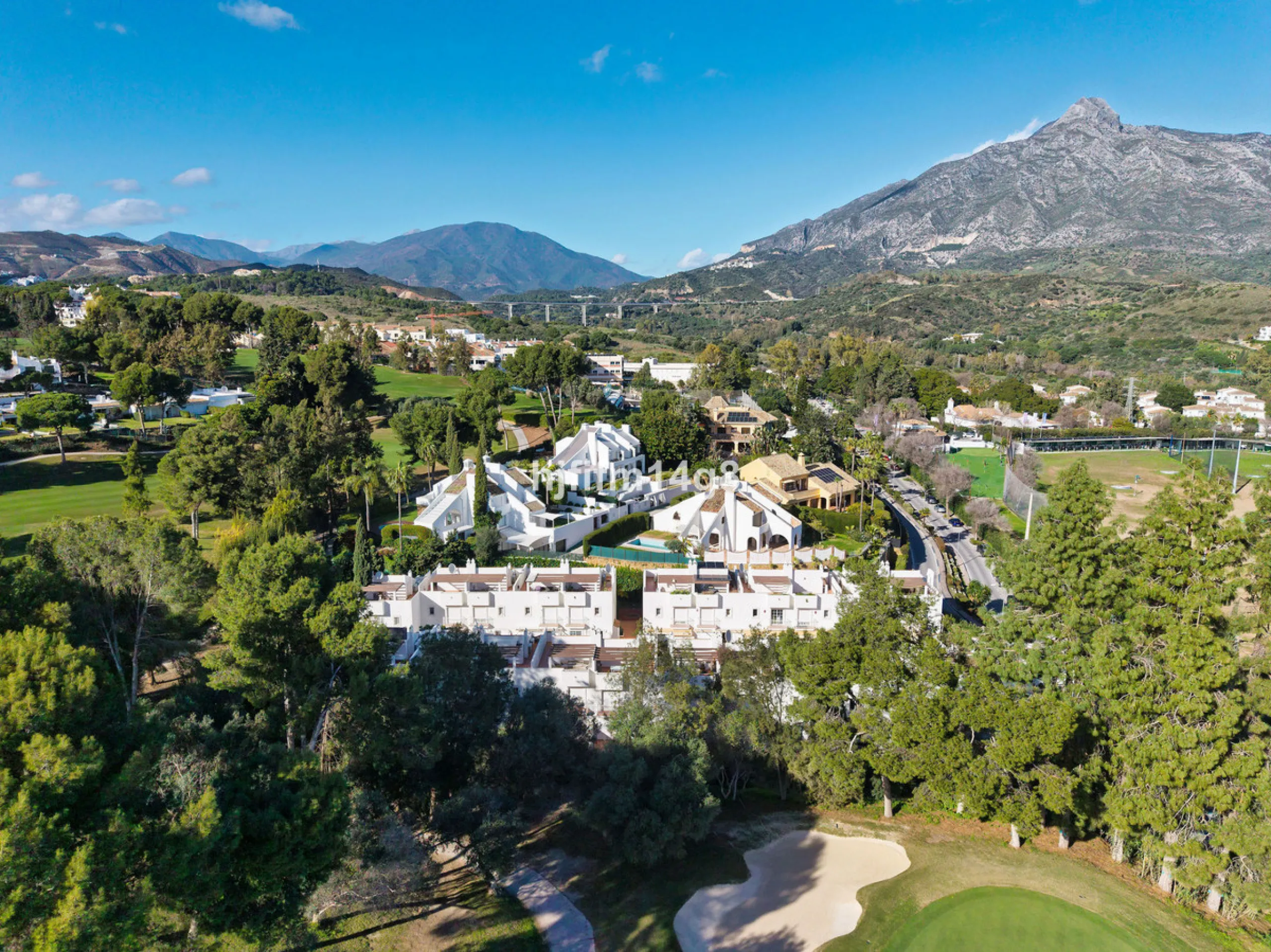 This stunning 3-bedroom townhouse is for sale in the highly sought-after El Alcornoque urbanisation in Nueva Andalucía, one of Marbella's most prestigious areas. Nestled front line to the renowned Aloha Golf Course, this exclusive development of just 22 u