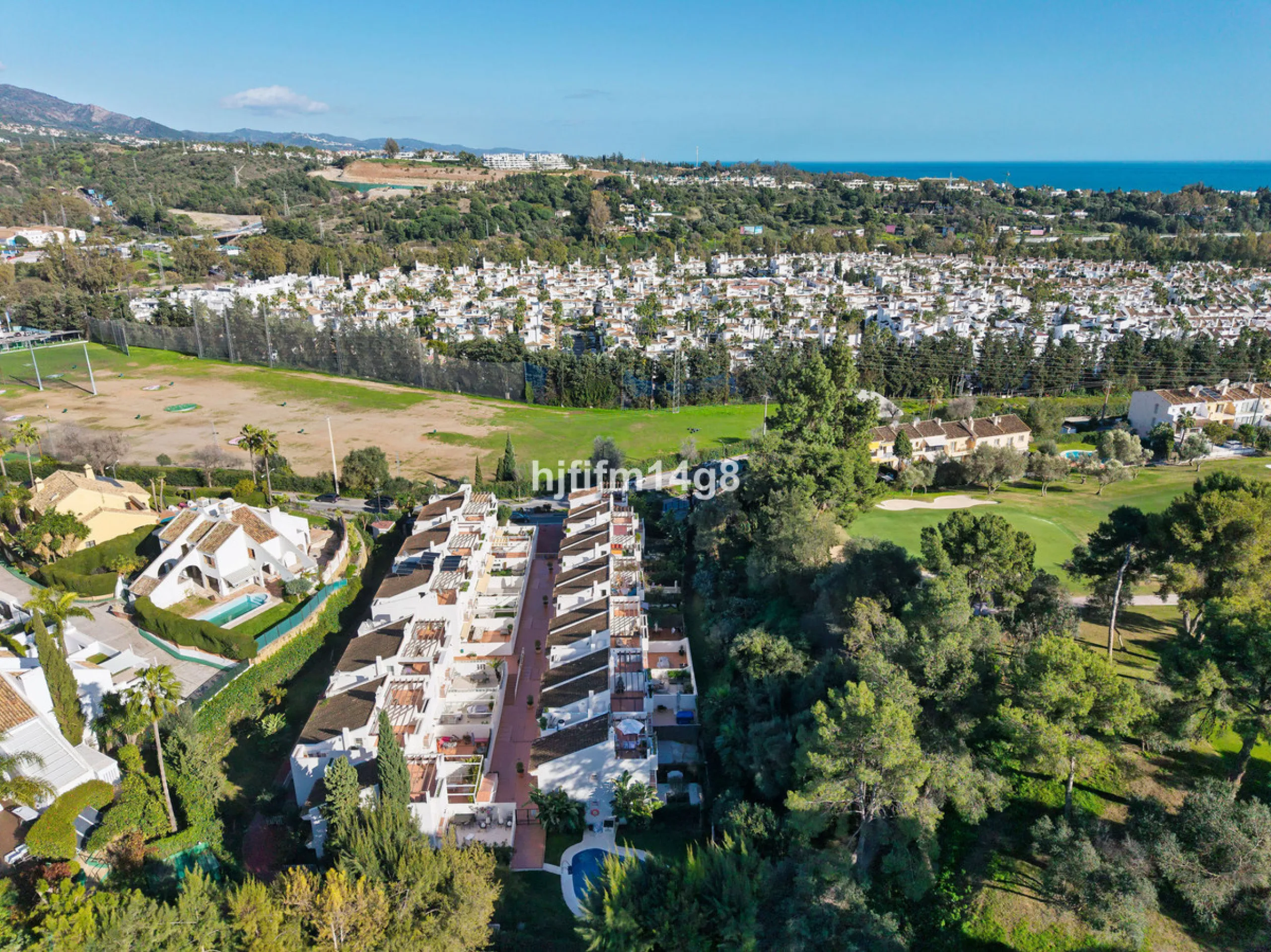 This stunning 3-bedroom townhouse is for sale in the highly sought-after El Alcornoque urbanisation in Nueva Andalucía, one of Marbella's most prestigious areas. Nestled front line to the renowned Aloha Golf Course, this exclusive development of just 22 u