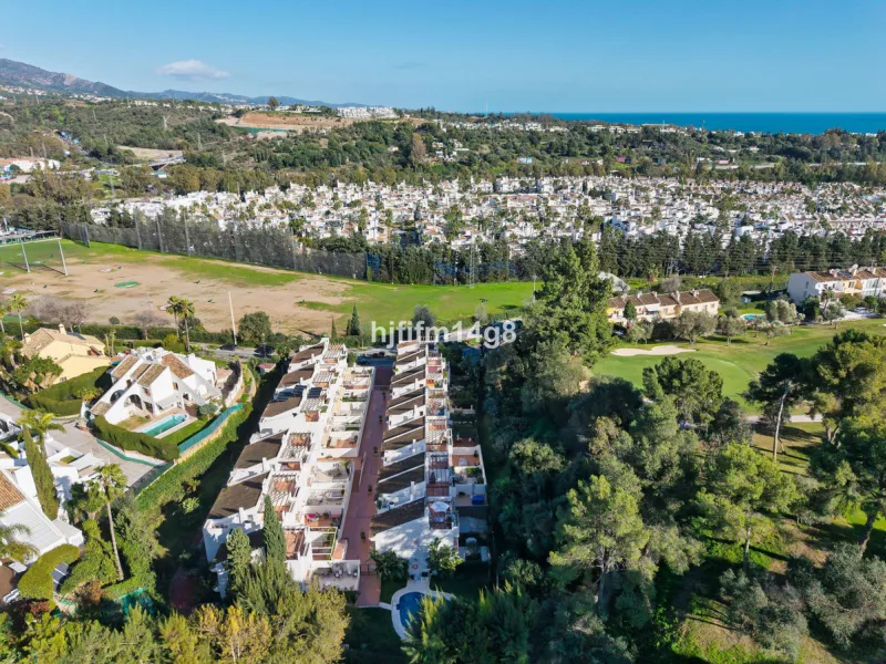 This stunning 3-bedroom townhouse is for sale in the highly sought-after El Alcornoque urbanisation in Nueva Andalucía, one of Marbella's most prestigious areas. Nestled front line to the renowned Aloha Golf Course, this exclusive development of just 22 u