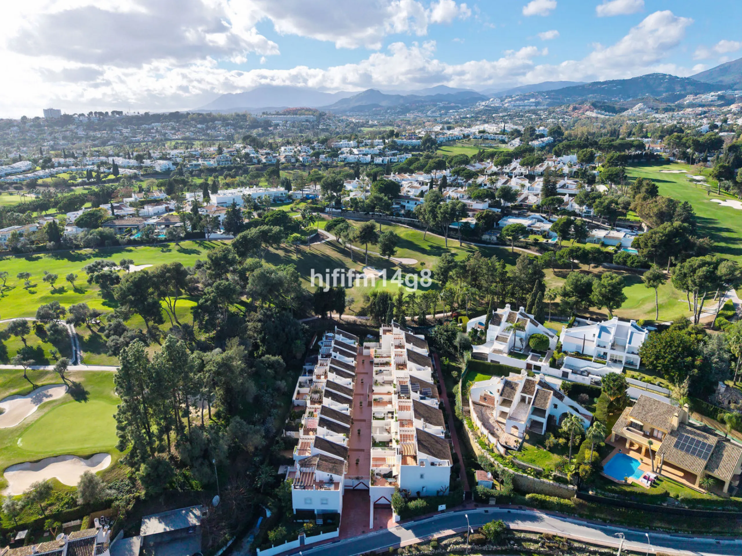 This stunning 3-bedroom townhouse is for sale in the highly sought-after El Alcornoque urbanisation in Nueva Andalucía, one of Marbella's most prestigious areas. Nestled front line to the renowned Aloha Golf Course, this exclusive development of just 22 u