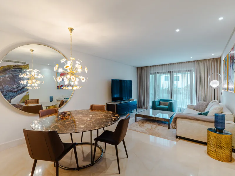 Located within the prestigious gated beachfront development of Doncella Beach in the prime residential area of Seghers, Estepona, this elegant ground floor apartment offers refined Mediterranean living in one of the most exclusive frontline communities on