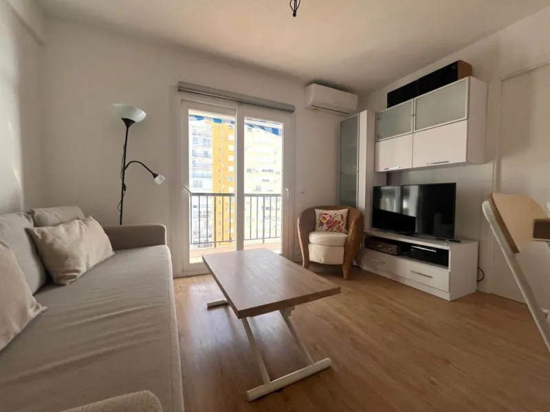 Discover a true beachfront gem in Calahonda. This fully renovated corner apartment, located on the front line of the beach, stands out for an exceptional and rarely found feature: a large wraparound terrace that surrounds almost the entire property, creat