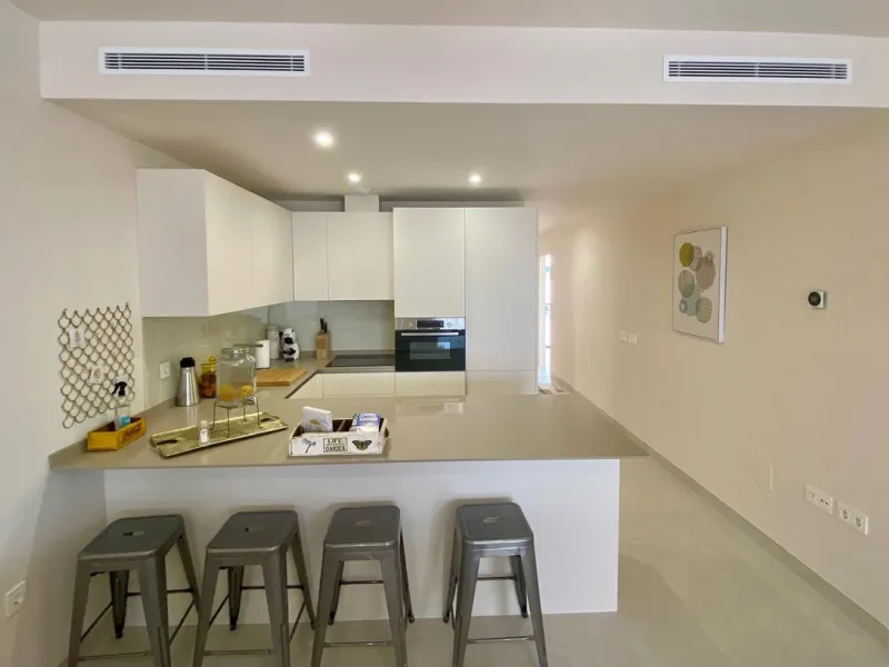 YOUR SECOND HOME AWAITS YOU! Discover refined Mediterranean living in this stylish contemporary apartment in the highly desirable area of Cala de Mijas, Mijas Costa. Nestled within an exclusive gated community (2021)and just a short stroll from the vibran
