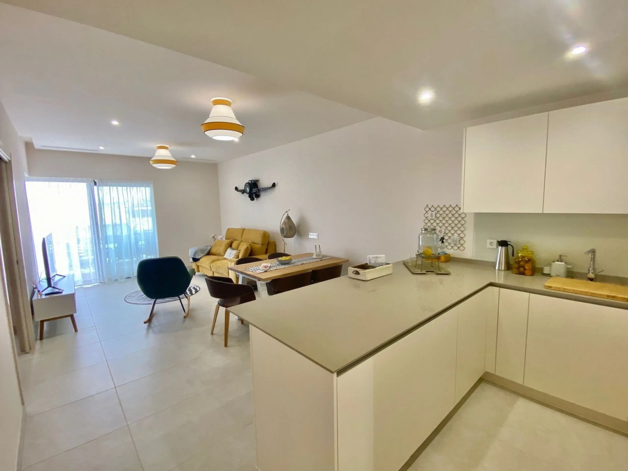 YOUR SECOND HOME AWAITS YOU! Discover refined Mediterranean living in this stylish contemporary apartment in the highly desirable area of Cala de Mijas, Mijas Costa. Nestled within an exclusive gated community (2021)and just a short stroll from the vibran