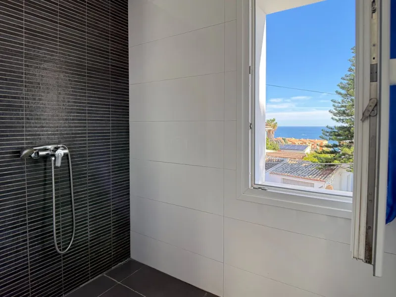 This modern villa has been recently renovated and sits in a fantastic location just 500 metres from the beach,  between La Cala de Mijas and Fuengirola. The home has a bright, contemporary feel throughout, with large windows that open onto the garden and 