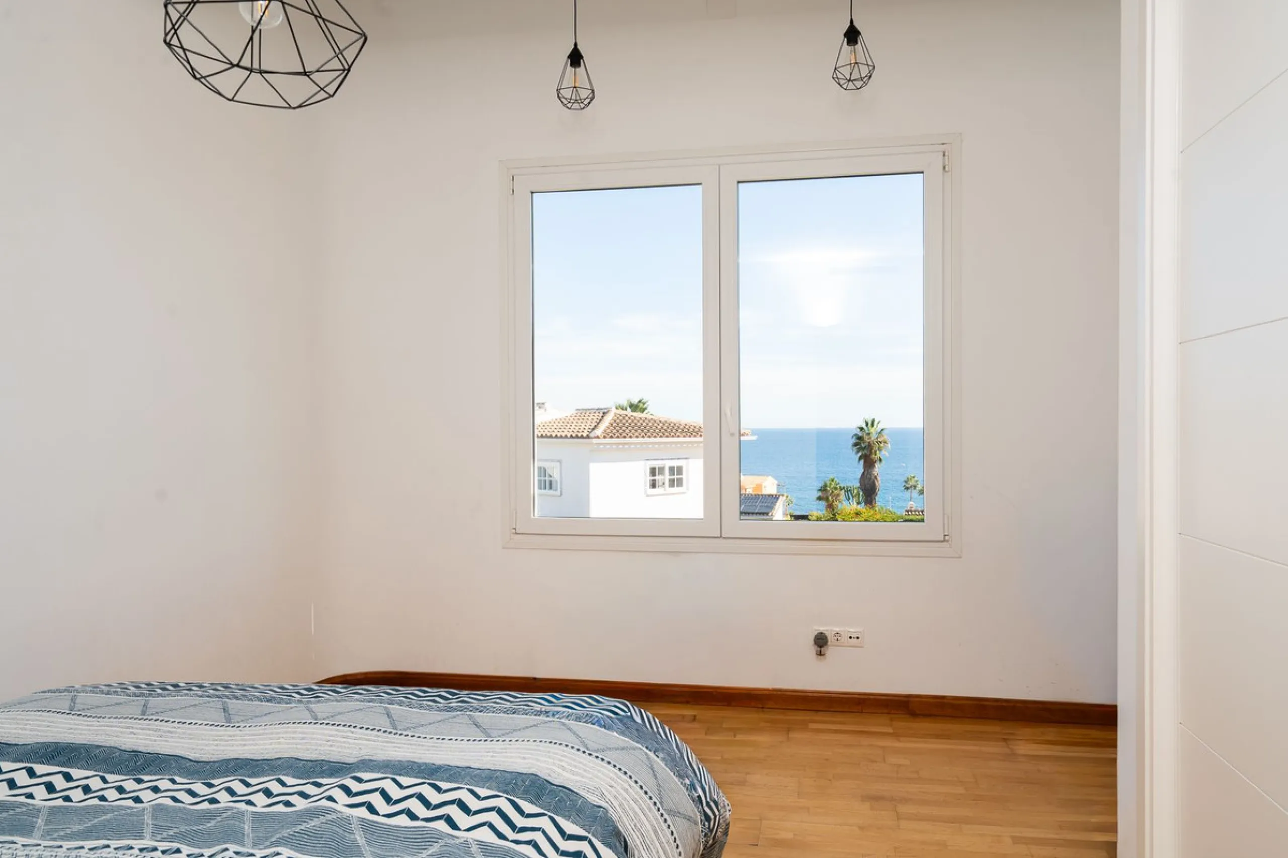 This modern villa has been recently renovated and sits in a fantastic location just 500 metres from the beach,  between La Cala de Mijas and Fuengirola. The home has a bright, contemporary feel throughout, with large windows that open onto the garden and 