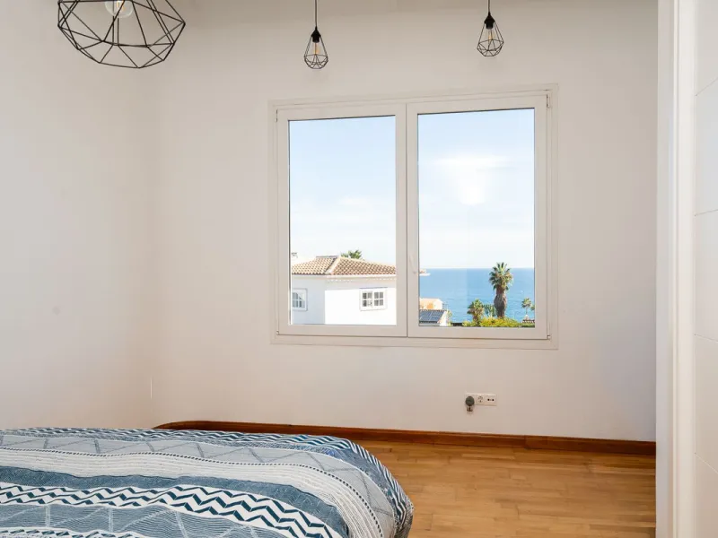 This modern villa has been recently renovated and sits in a fantastic location just 500 metres from the beach,  between La Cala de Mijas and Fuengirola. The home has a bright, contemporary feel throughout, with large windows that open onto the garden and 