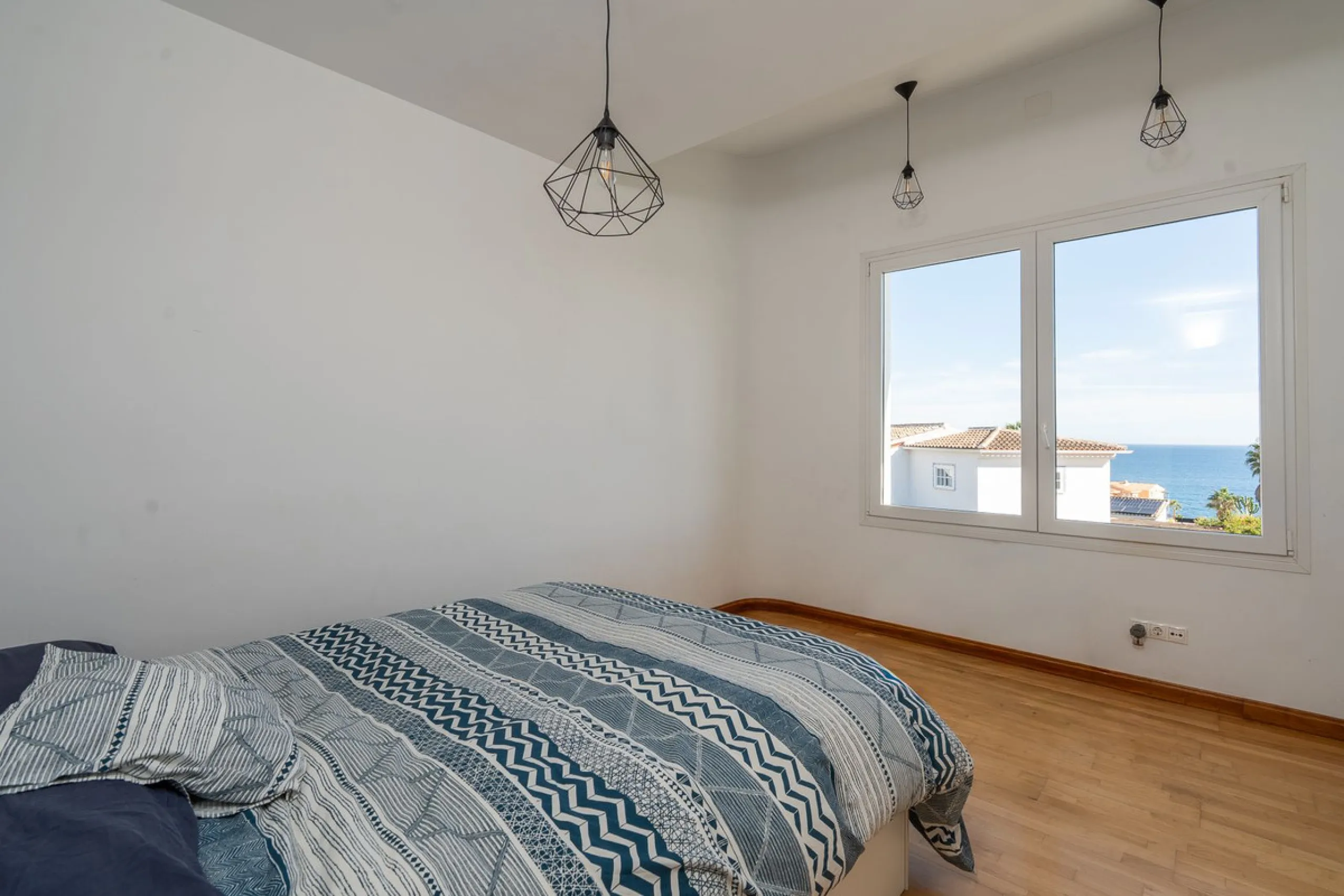 This modern villa has been recently renovated and sits in a fantastic location just 500 metres from the beach,  between La Cala de Mijas and Fuengirola. The home has a bright, contemporary feel throughout, with large windows that open onto the garden and 
