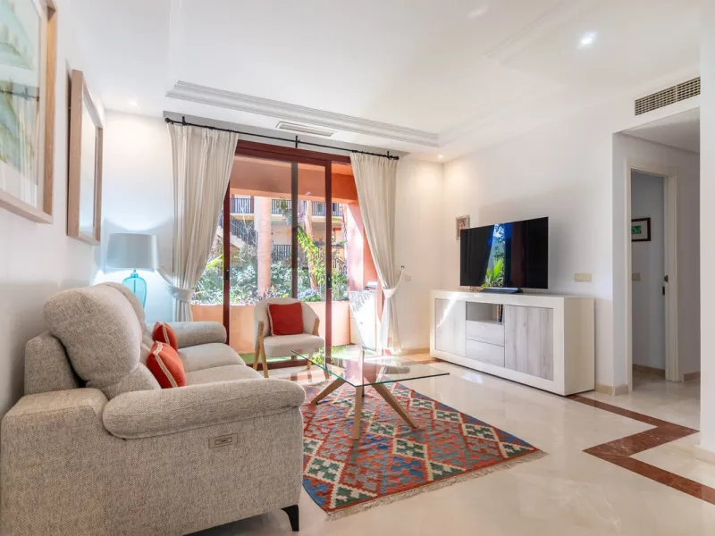 An apartment with 3 bedrooms, 2 bathrooms, a spacious living room, and a new kitchen with a dining area overlooking a beautiful garden with a fountain. The property is located in a unique, lush residential community where the views from the terrace and wi