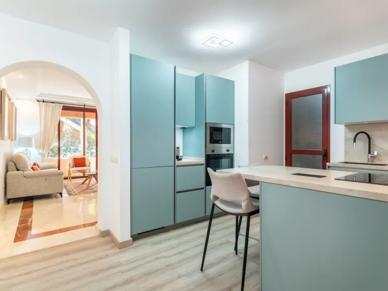 An apartment with 3 bedrooms, 2 bathrooms, a spacious living room, and a new kitchen with a dining area overlooking a beautiful garden with a fountain. The property is located in a unique, lush residential community where the views from the terrace and wi