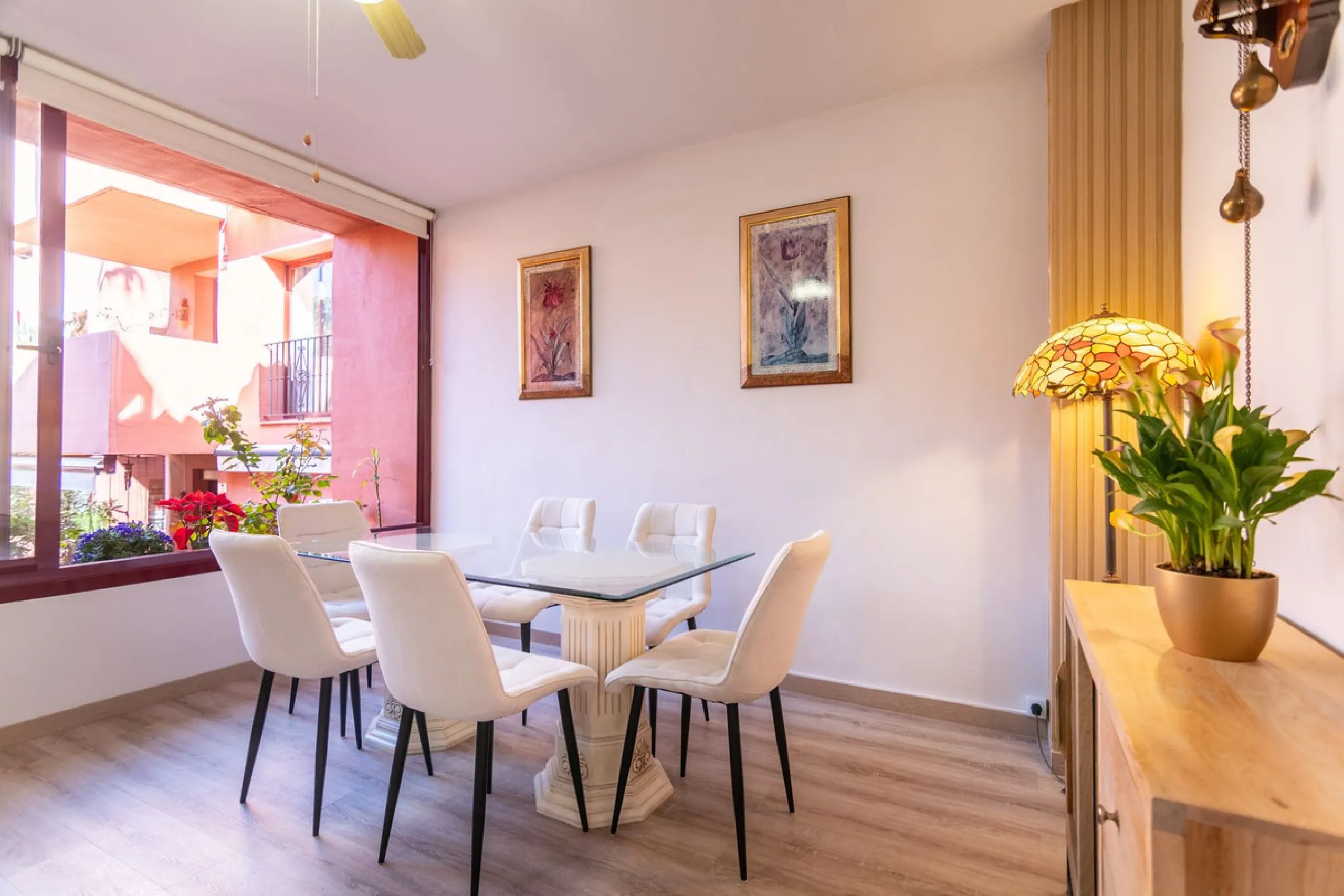 An apartment with 3 bedrooms, 2 bathrooms, a spacious living room, and a new kitchen with a dining area overlooking a beautiful garden with a fountain. The property is located in a unique, lush residential community where the views from the terrace and wi