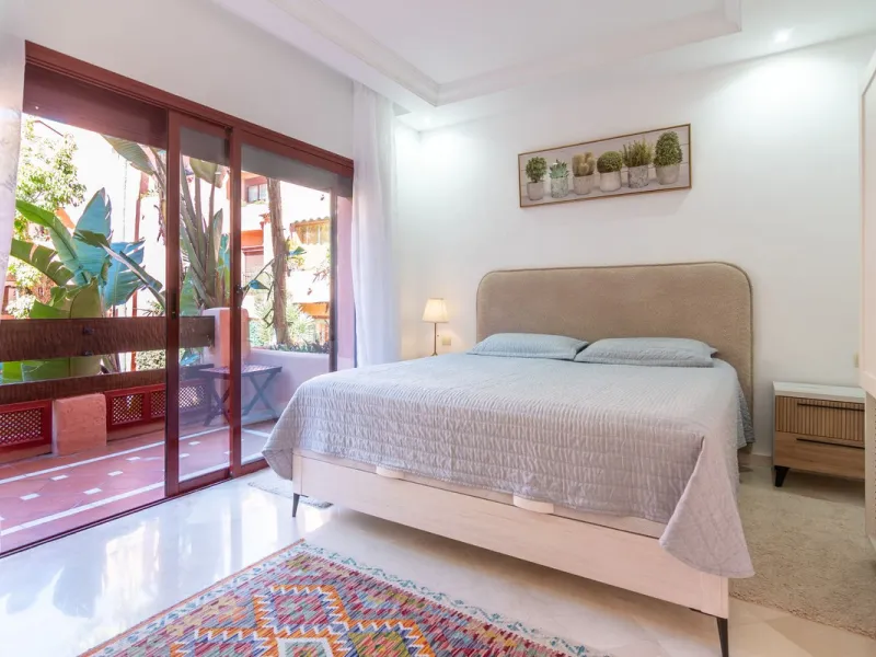 An apartment with 3 bedrooms, 2 bathrooms, a spacious living room, and a new kitchen with a dining area overlooking a beautiful garden with a fountain. The property is located in a unique, lush residential community where the views from the terrace and wi