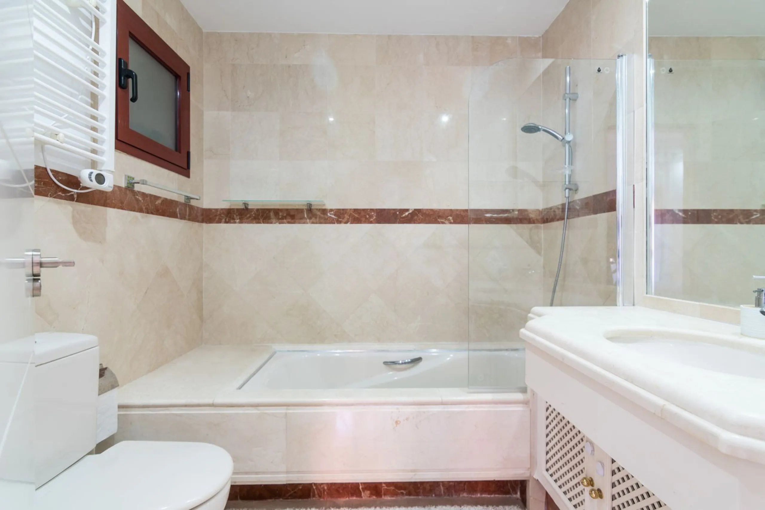 An apartment with 3 bedrooms, 2 bathrooms, a spacious living room, and a new kitchen with a dining area overlooking a beautiful garden with a fountain. The property is located in a unique, lush residential community where the views from the terrace and wi