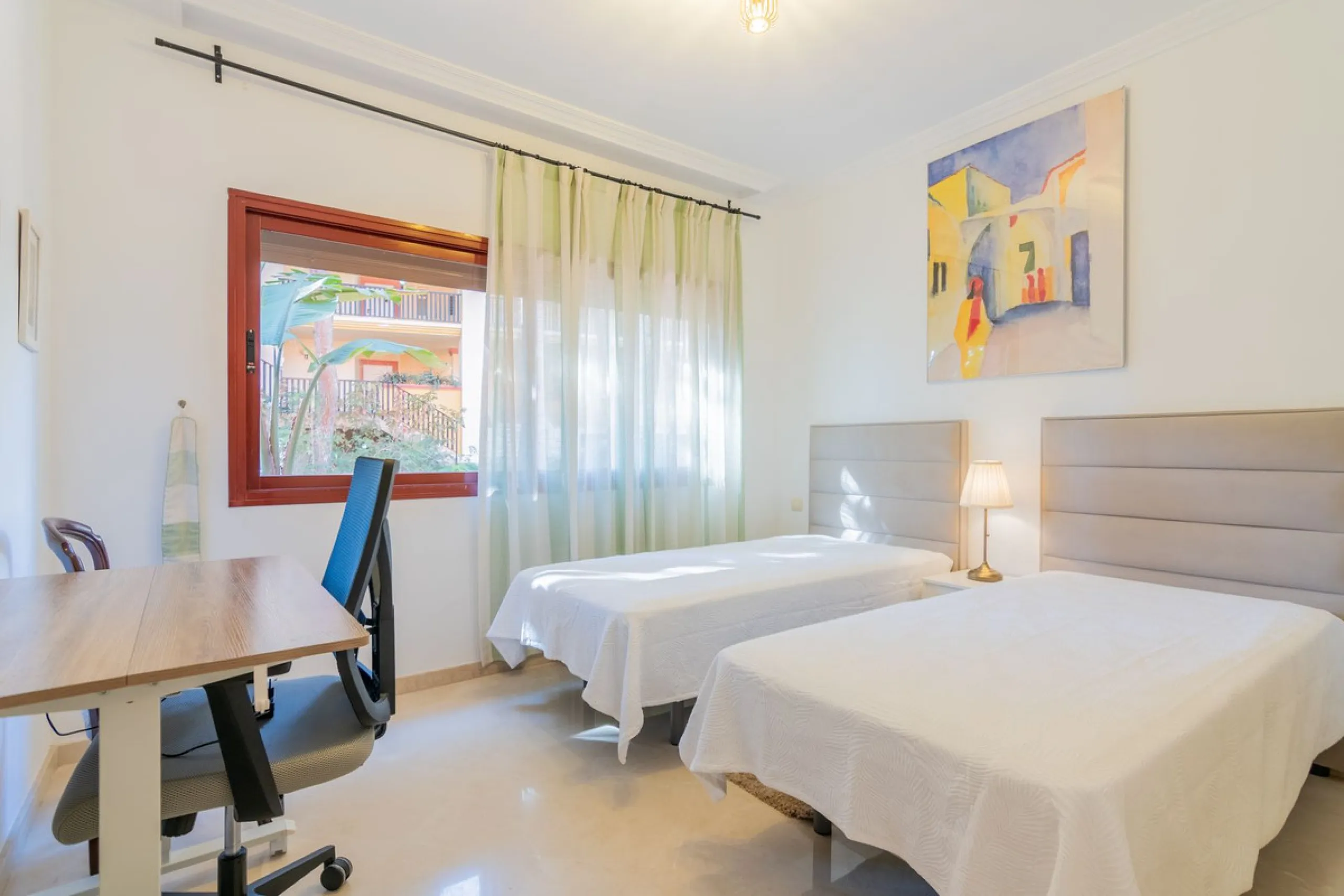 An apartment with 3 bedrooms, 2 bathrooms, a spacious living room, and a new kitchen with a dining area overlooking a beautiful garden with a fountain. The property is located in a unique, lush residential community where the views from the terrace and wi