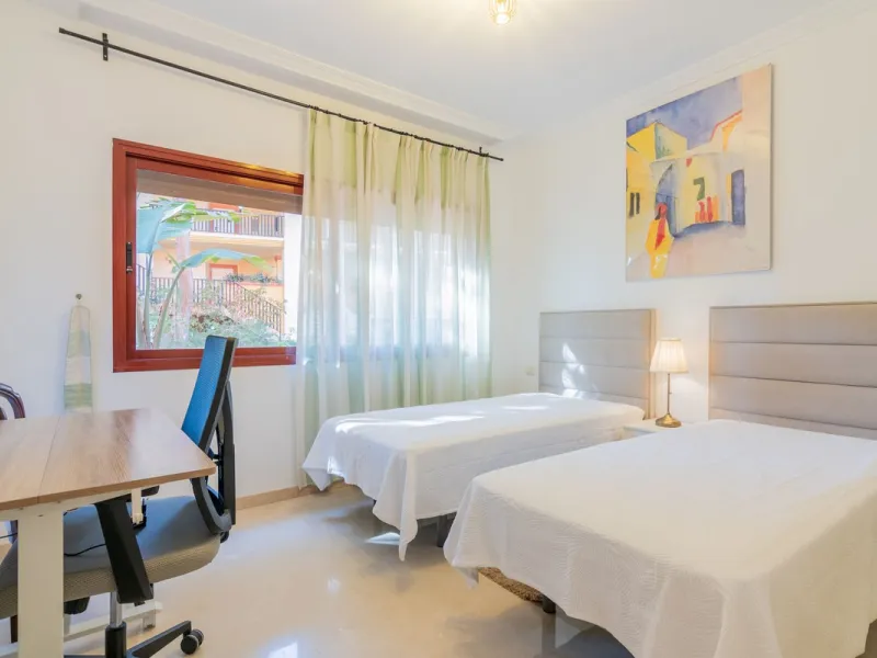 An apartment with 3 bedrooms, 2 bathrooms, a spacious living room, and a new kitchen with a dining area overlooking a beautiful garden with a fountain. The property is located in a unique, lush residential community where the views from the terrace and wi