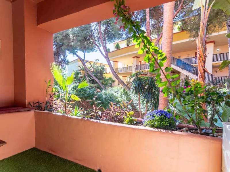 An apartment with 3 bedrooms, 2 bathrooms, a spacious living room, and a new kitchen with a dining area overlooking a beautiful garden with a fountain. The property is located in a unique, lush residential community where the views from the terrace and wi
