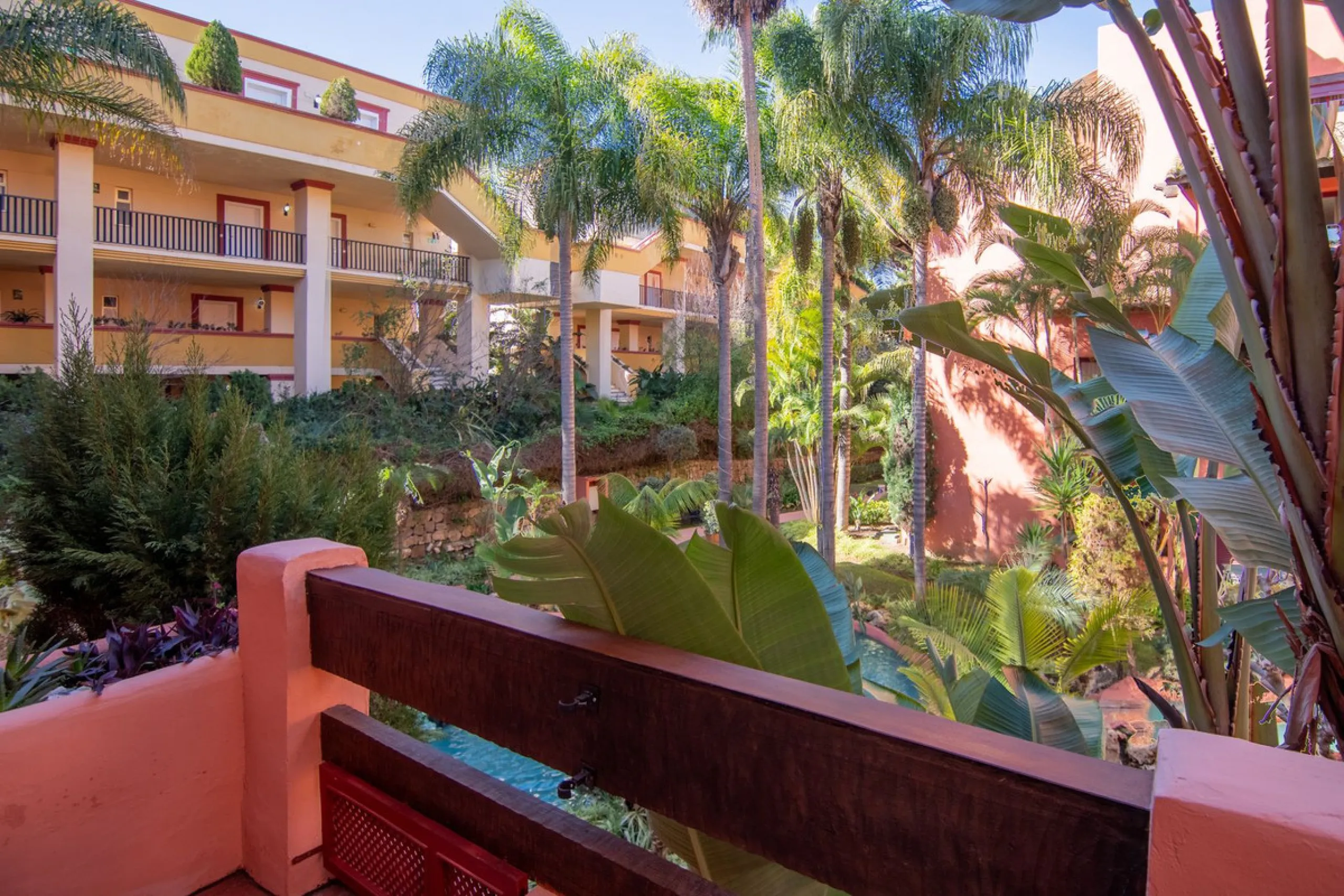 An apartment with 3 bedrooms, 2 bathrooms, a spacious living room, and a new kitchen with a dining area overlooking a beautiful garden with a fountain. The property is located in a unique, lush residential community where the views from the terrace and wi