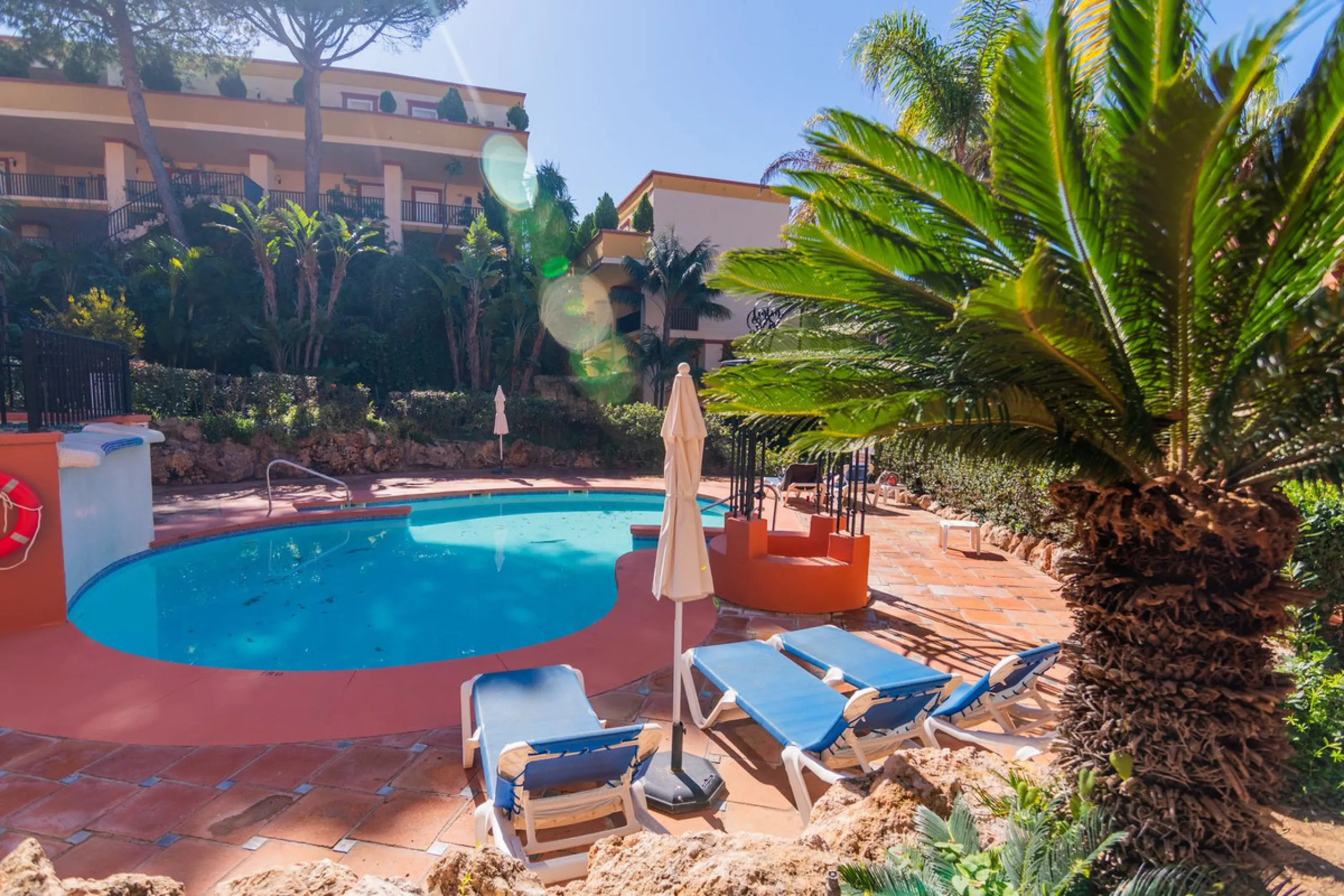 An apartment with 3 bedrooms, 2 bathrooms, a spacious living room, and a new kitchen with a dining area overlooking a beautiful garden with a fountain. The property is located in a unique, lush residential community where the views from the terrace and wi