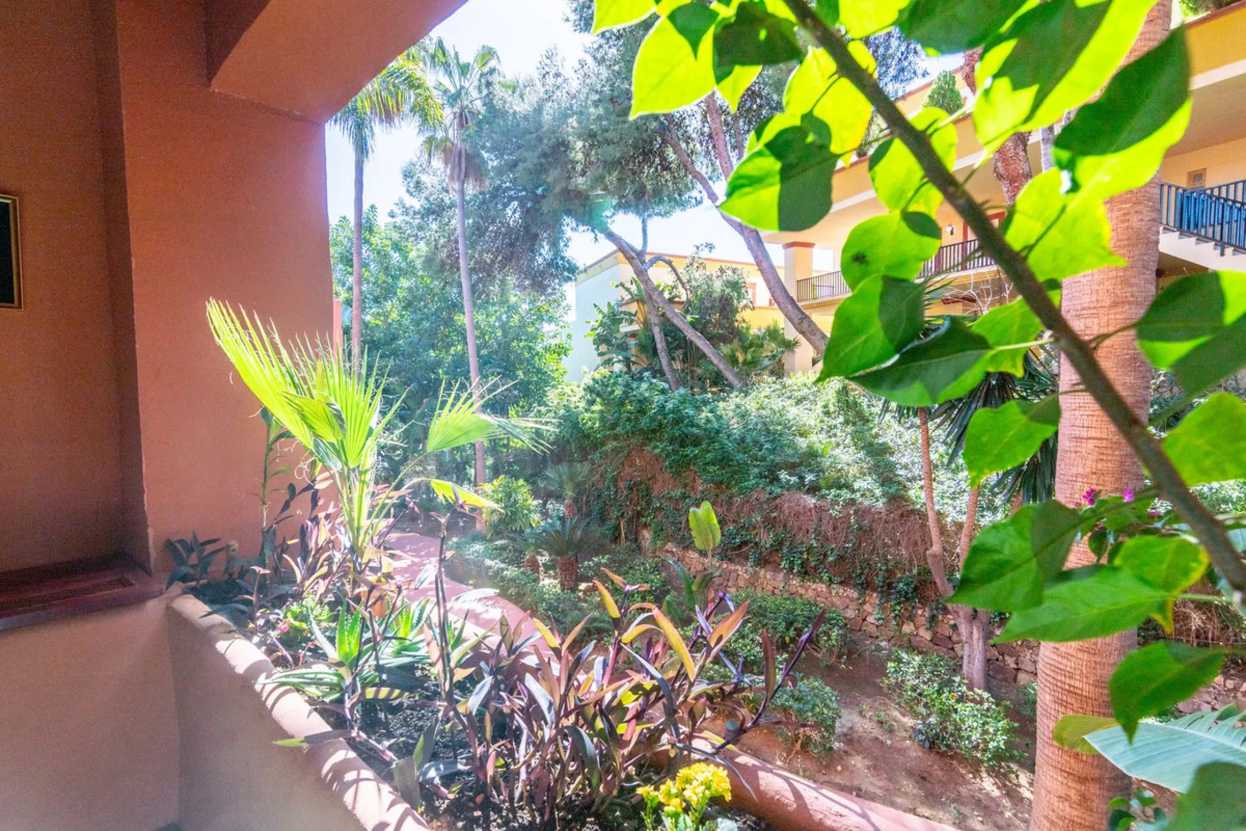 An apartment with 3 bedrooms, 2 bathrooms, a spacious living room, and a new kitchen with a dining area overlooking a beautiful garden with a fountain. The property is located in a unique, lush residential community where the views from the terrace and wi