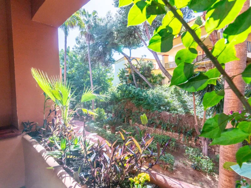An apartment with 3 bedrooms, 2 bathrooms, a spacious living room, and a new kitchen with a dining area overlooking a beautiful garden with a fountain. The property is located in a unique, lush residential community where the views from the terrace and wi