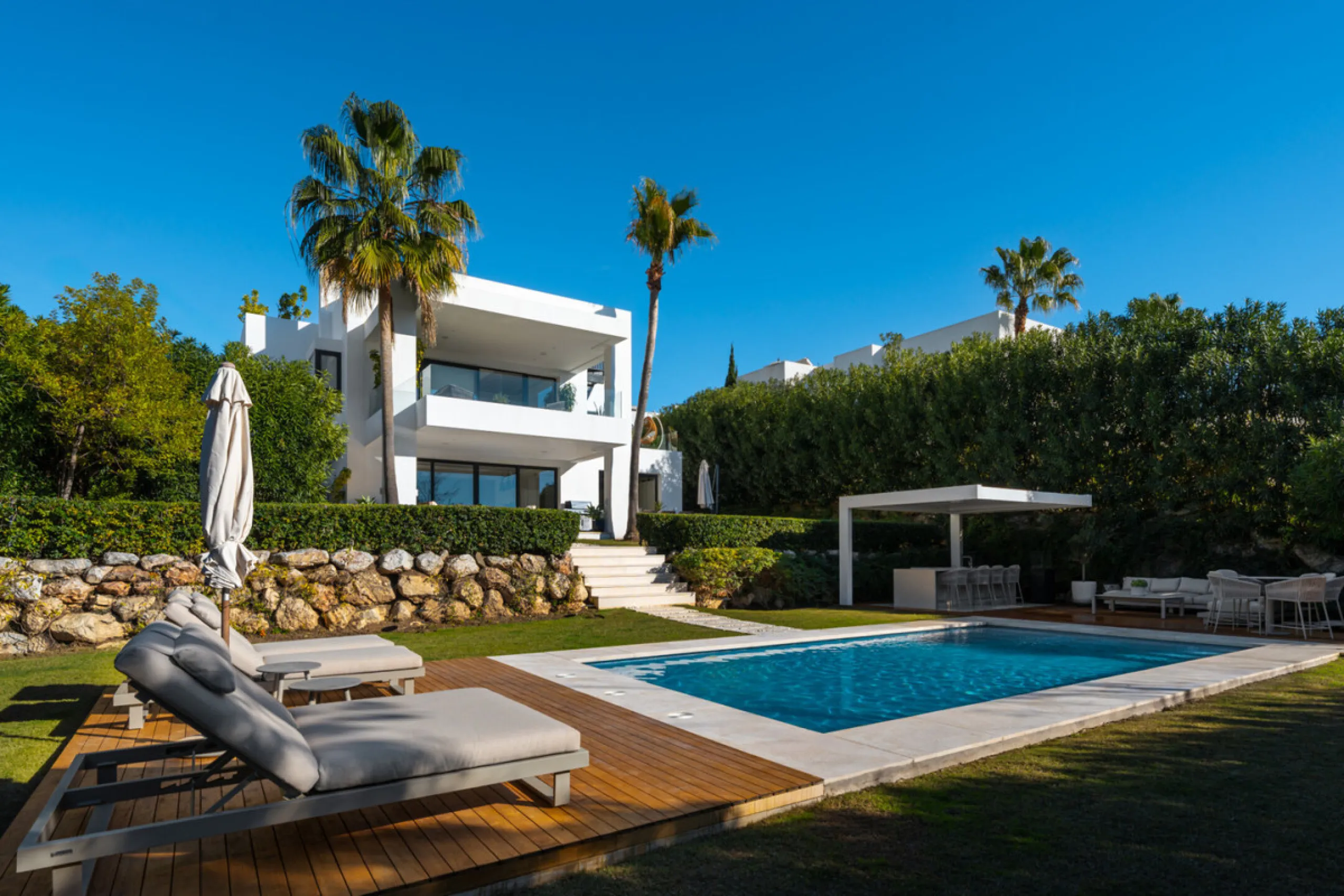Set within the prestigious, fully gated Los Olivos community with 24/7 security, this contemporary villa sits on the largest plot in the development, offering unmatched privacy, space, and a prime location. Occupying a generous 1,351 m² plot, the property