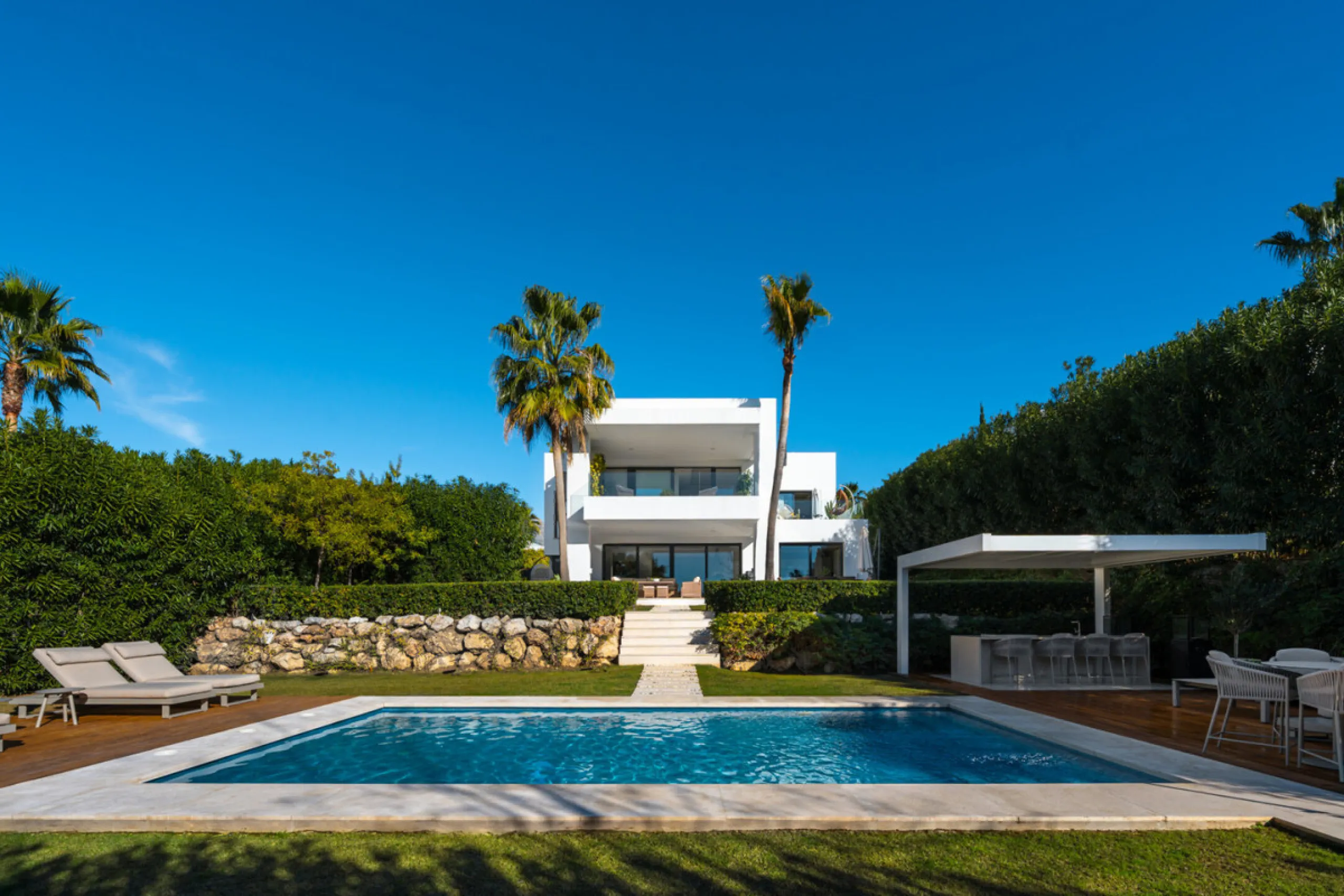 Set within the prestigious, fully gated Los Olivos community with 24/7 security, this contemporary villa sits on the largest plot in the development, offering unmatched privacy, space, and a prime location. Occupying a generous 1,351 m² plot, the property