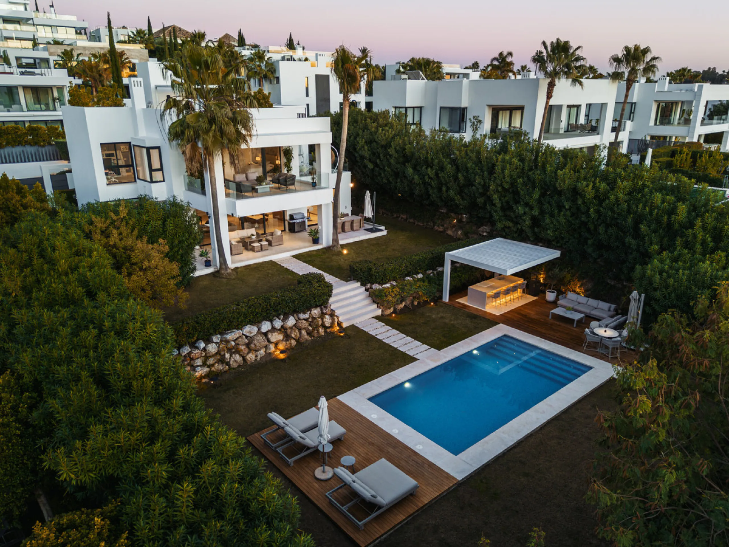 Set within the prestigious, fully gated Los Olivos community with 24/7 security, this contemporary villa sits on the largest plot in the development, offering unmatched privacy, space, and a prime location. Occupying a generous 1,351 m² plot, the property