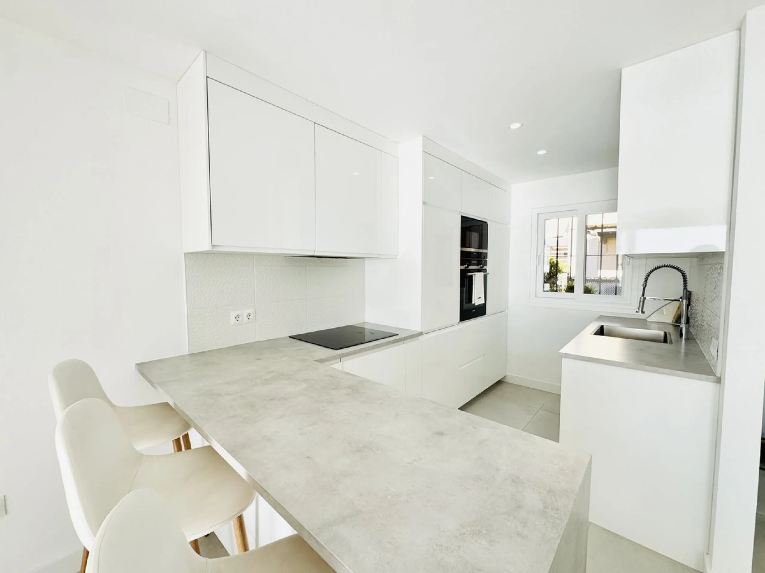 Stylish, fully renovated townhouse in the heart of Mijas Costa just steps from Fuengirola's beach walk, ideal as a permanent home, holiday residence or investement with excellent rental potential.