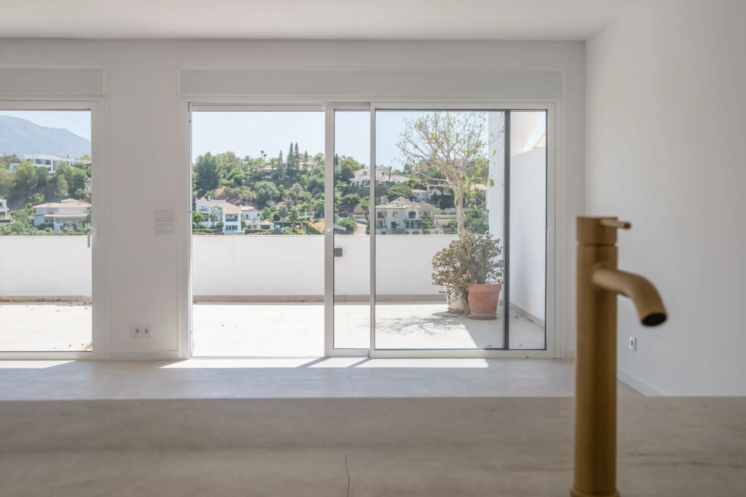 Located in the hills of Benahavis, this 143 sqm. residence is more than just an apartment; it is a curated experience of light and volume. As one of the largest units in this complex, the home has been meticulously reimagined to meet the exacting standard