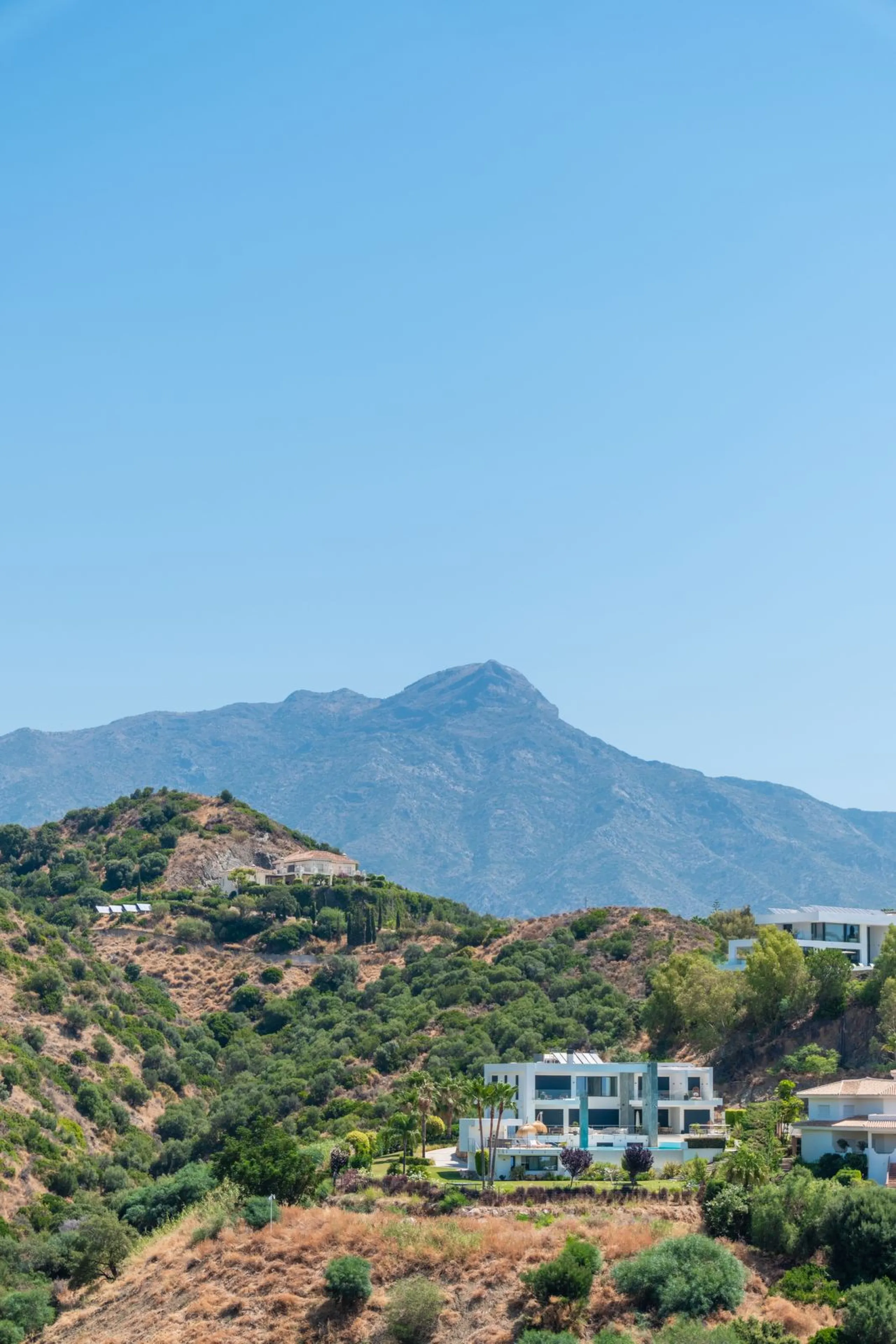 Located in the hills of Benahavis, this 143 sqm. residence is more than just an apartment; it is a curated experience of light and volume. As one of the largest units in this complex, the home has been meticulously reimagined to meet the exacting standard